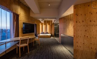 wood-clad wals inside One@Tokyo hotel by Kengo Kuma