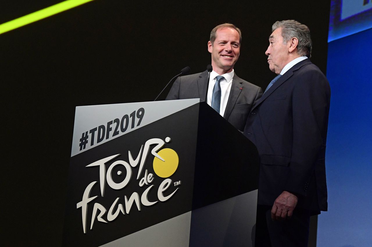 Christian Prudhomme on stage with Eddy Merckx, who is being celebrated with the Brussels Grand D&eacute;part