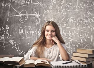 girl with math on chalkboard