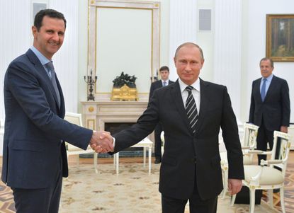 Syrian President Bashar al-Assad meets with Russia's Vladimir Putin in Moscow