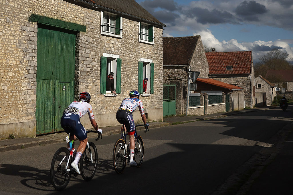 Soudal Quick-Step's Danish rider Casper Pedersen and TotalEnergies' French rider Mathis Le Berre (L) ride in a breakaway during the 2nd stage of the Paris-Nice cycling race, 187 km between &amp;Eacute;p&amp;ocirc;ne and Montargis, on March 9, 2026. (Photo by Anne-Christine POUJOULAT / AFP)