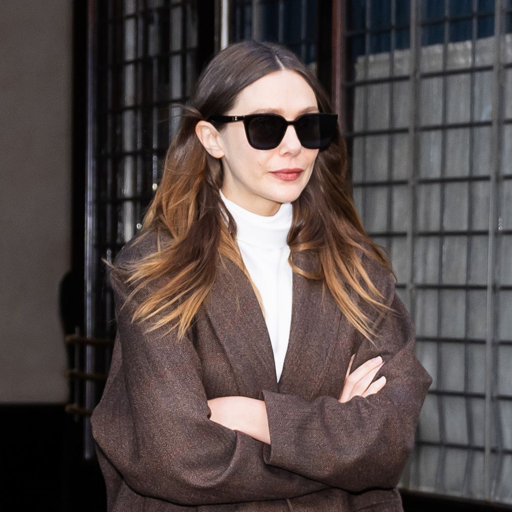 Elizabeth Olsen Hit the Airport in Winter's Richest Denim Trend and "It" Coat Color