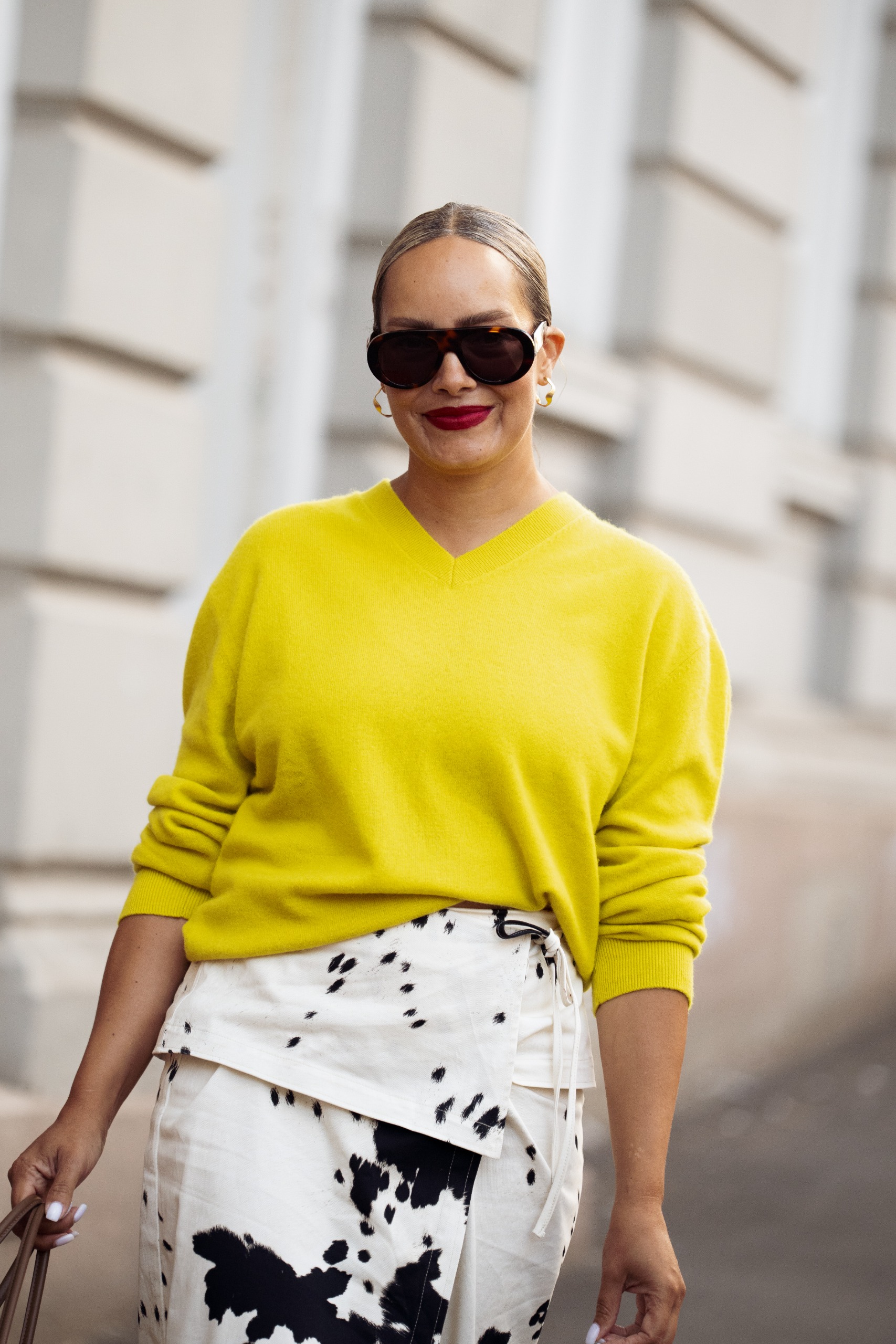 woman in yellow sweater street style