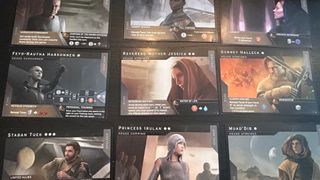 Dune: Imperium - Uprising cards laid out in a grid on a dark surface