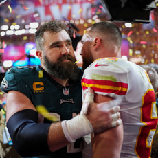 Jason Kelce #62 of the Philadelphia Eagles speaks with Travis Kelce #87 of the Kansas City Chiefs after Super Bowl LVII at State Farm Stadium on February 12, 2023 in Glendale, Arizona. The Chiefs defeated the Eagles 38-35