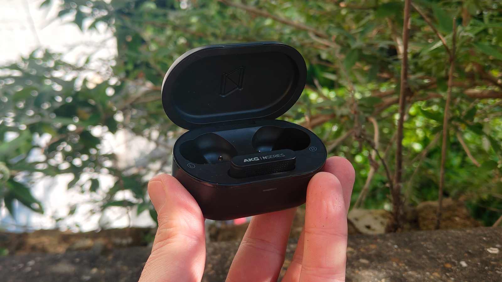 The AKG N5 in a man's hand.