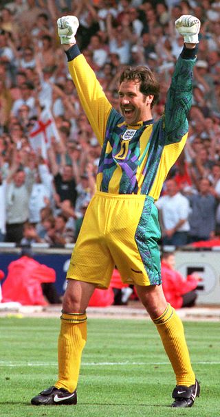 David Seaman celebrates saving a penalty from Scotland’s Gary McAllister at Euro 96