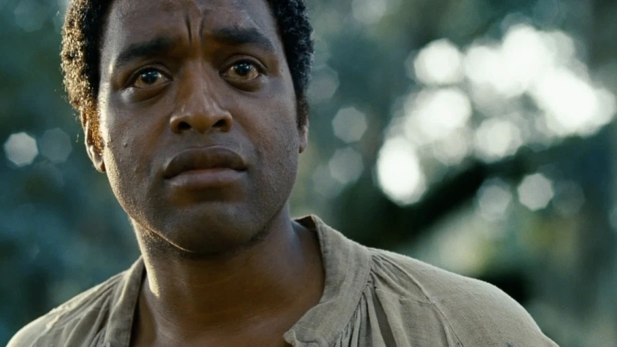 A still of Chiwetel Ejiofor in 12 Years a Slave, showing a close up of his face.