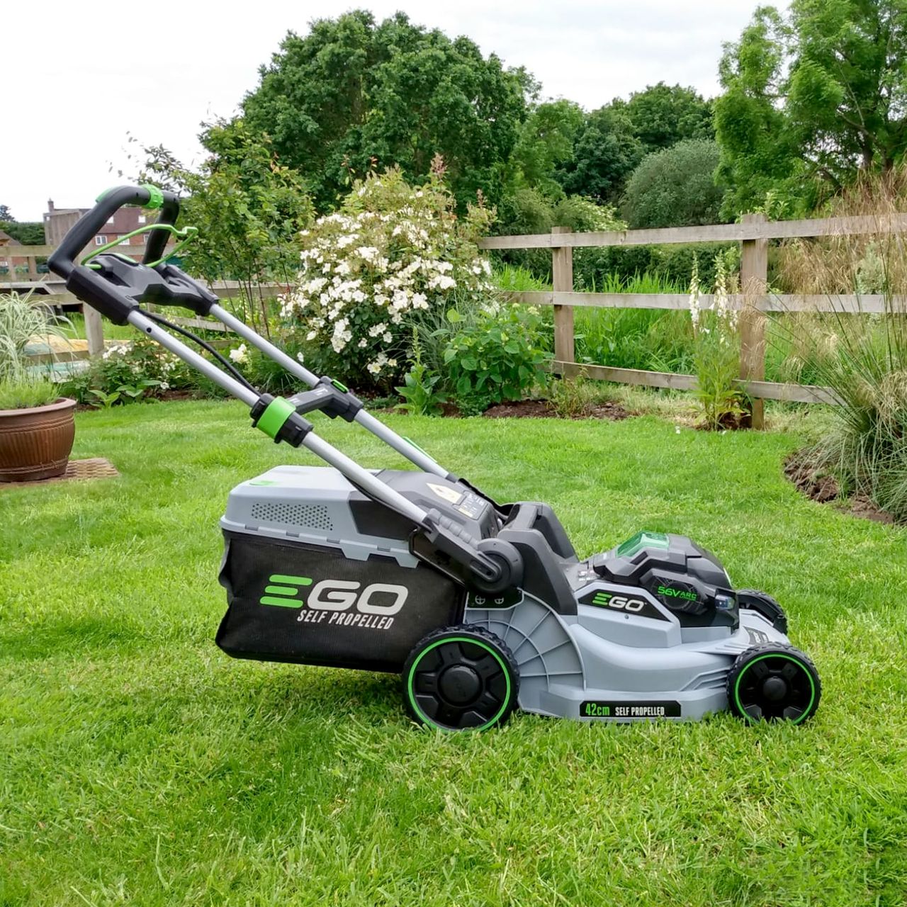 The EGO LM1702E-SP 42cm Self-Propelled Lawnmower being tested on a green lawn