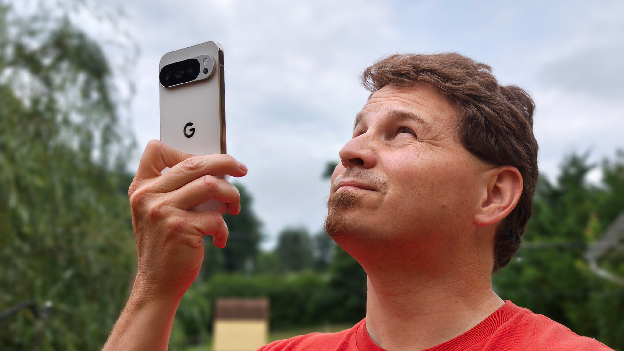 Holding a Google Pixel 10 Pro XL up to check T-Mobile T-Satellite connectivity