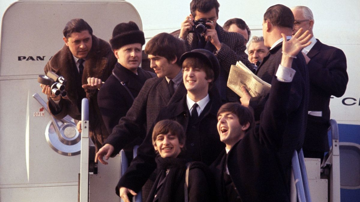 The Beatles in arrive in the US in 1964