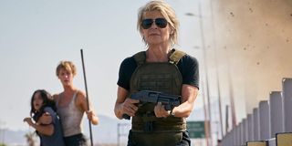 Terminator: Dark Fate Linda Hamilton walking with her shotgun in her hands