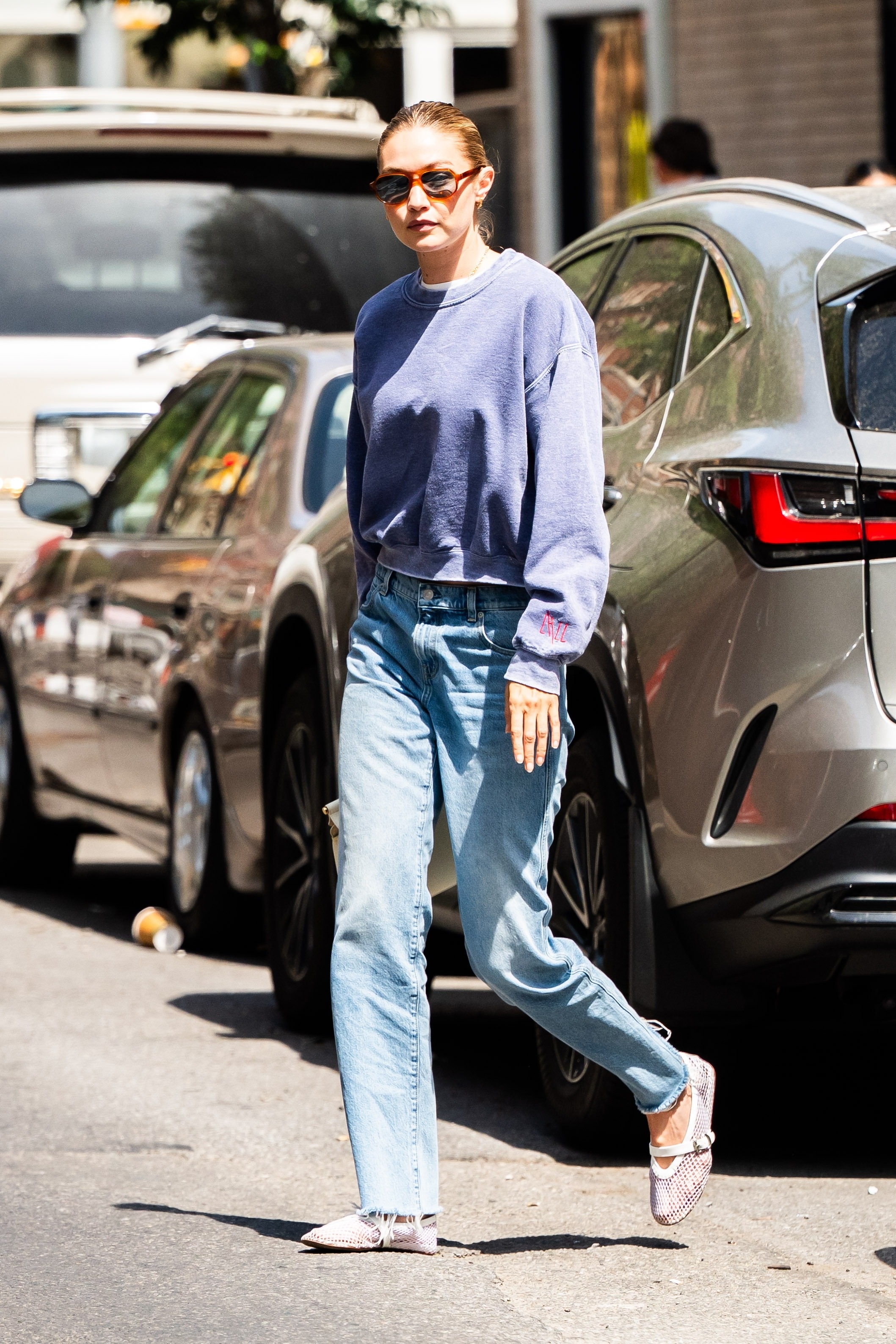 Gigi Hadid styled the mesh ballet flats trend with cigarette jeans in New York City