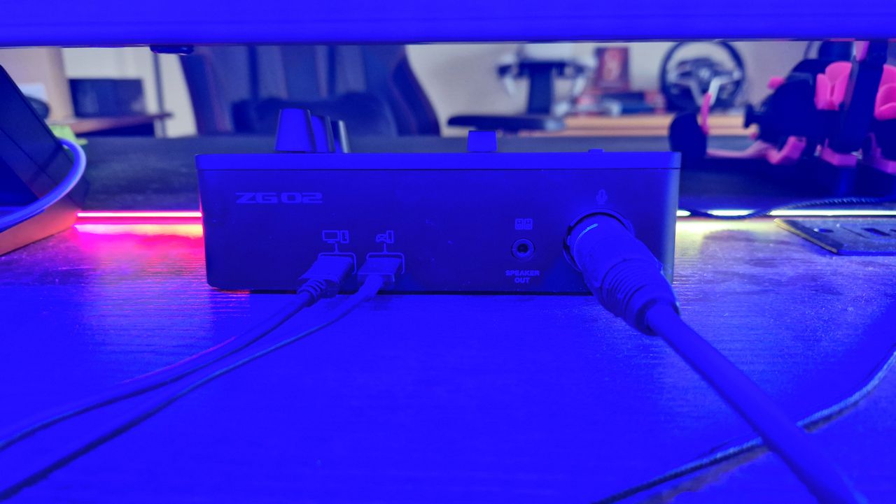 Yamaha ZG02 rear IO ports under blue lighting