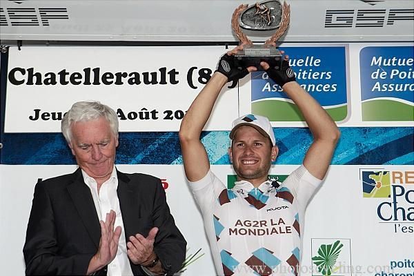 Anthony Ravard (AG2R) hoists his stage winner's trophy high