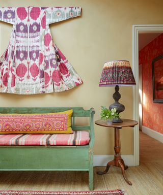 A colorful landing in a country home in Sussex designed by Kate Forman
