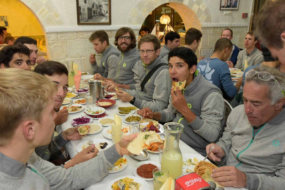 Riders eat Arab dinner in Akka.