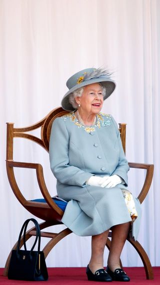 Queen Elizabeth II attends a military parade, held by the Household Division
