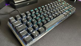 Corsair K65 Pro Mini RGB full keyboard on a matte black surface