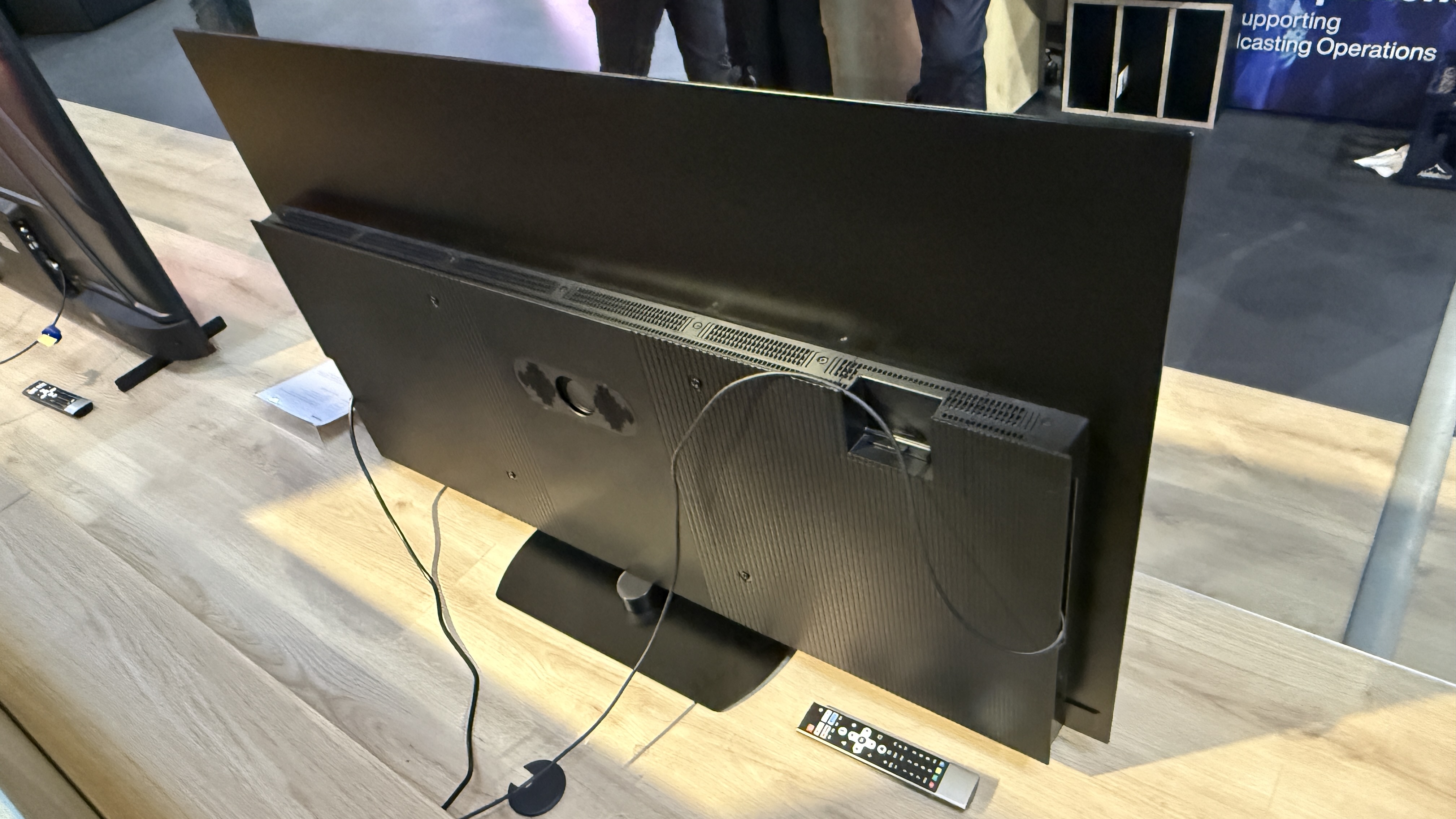 Panasonic Z85C with sci-fi images on screen sitting on a wooden tabletop