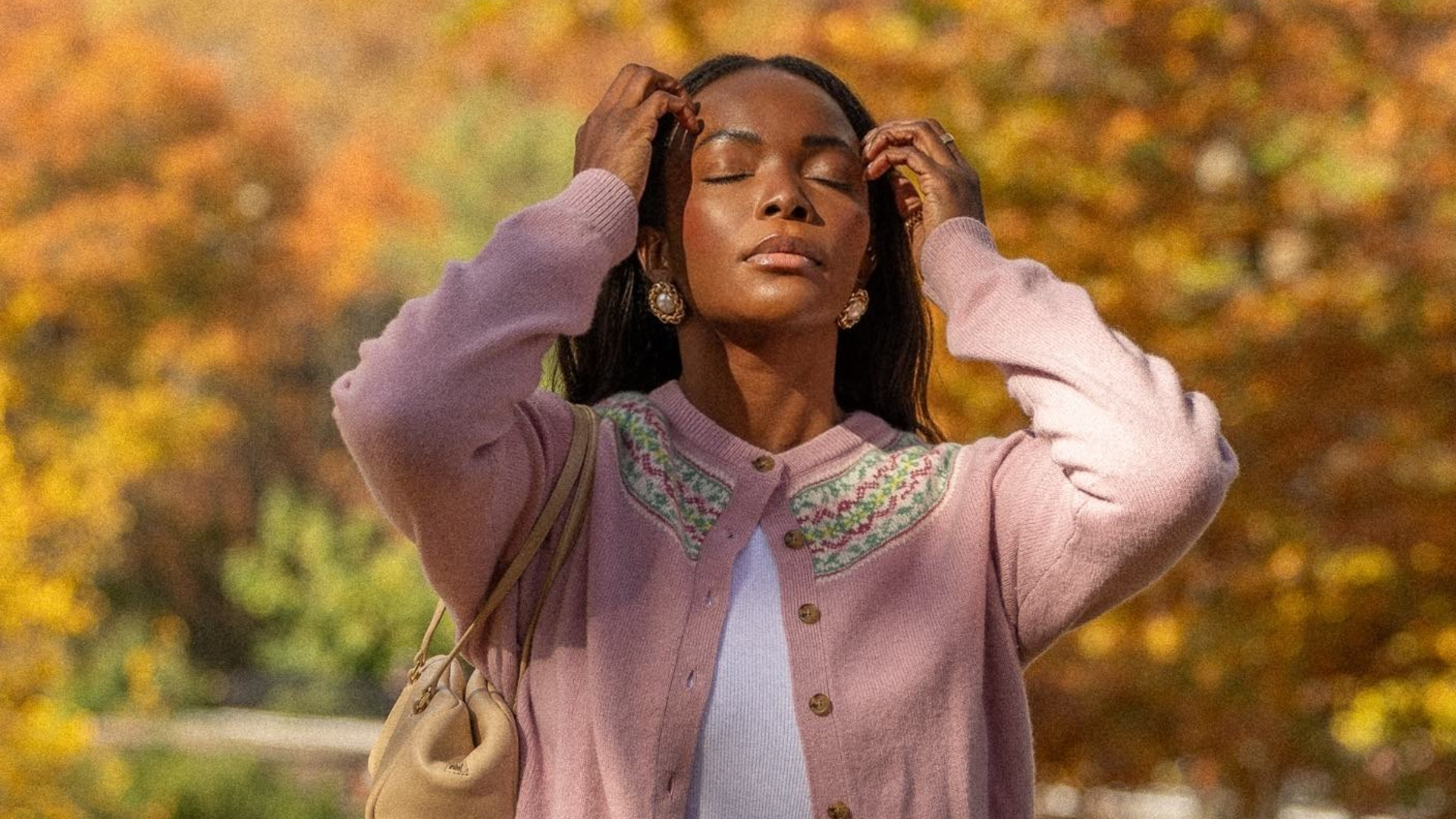 A woman walks outside in a park