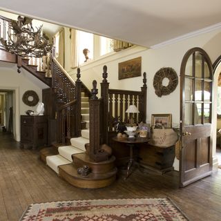 living room with stairs and white window