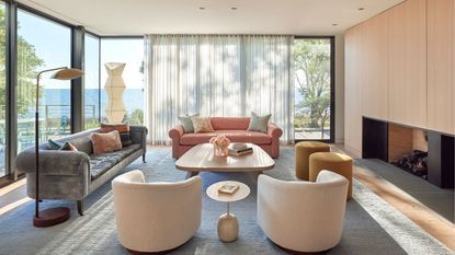 Living room with coffee table and windows out to garden