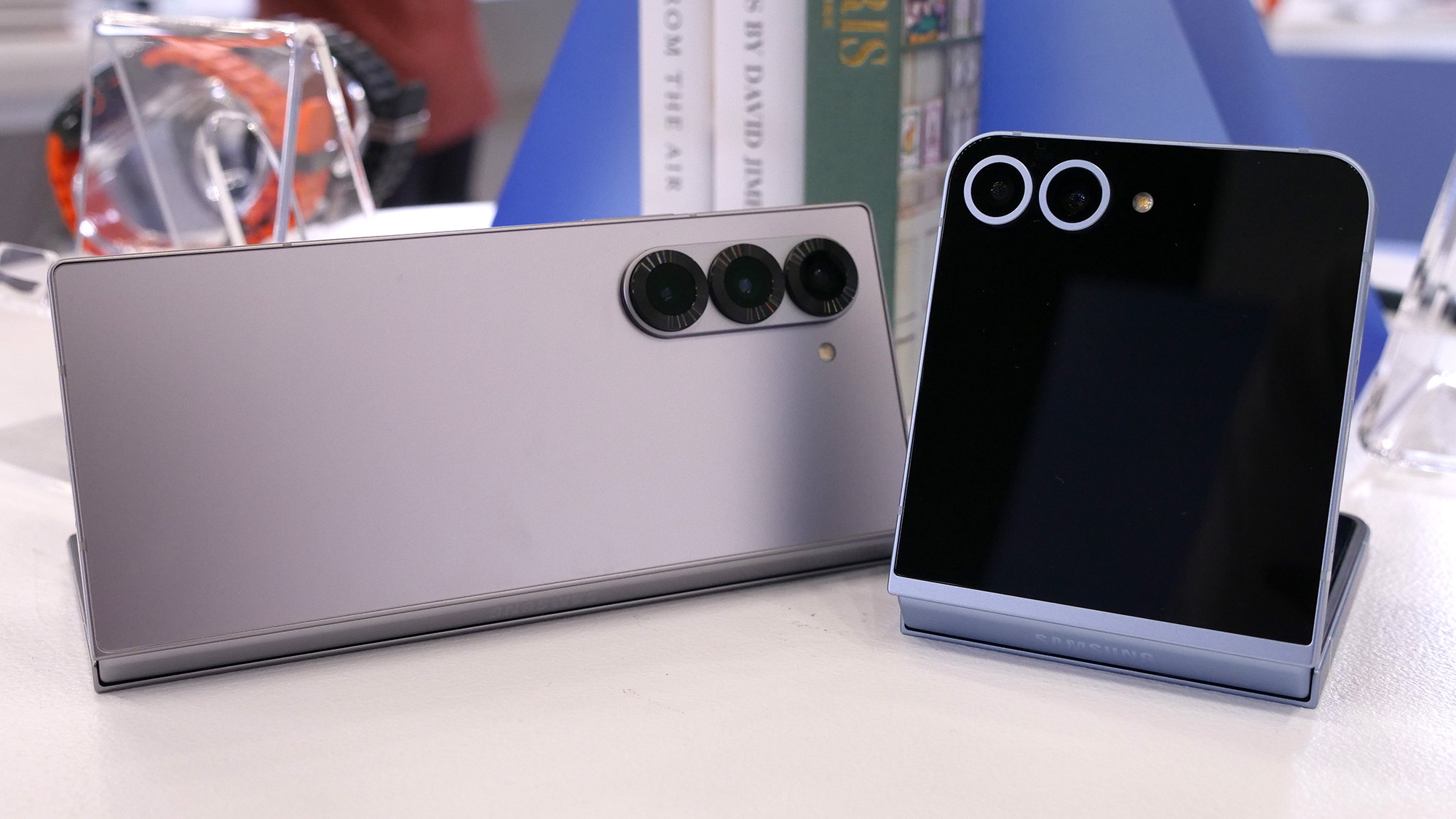 Samsung Galaxy Z Fold 6 and Galaxy Z Flip 6 half unfolded on a table