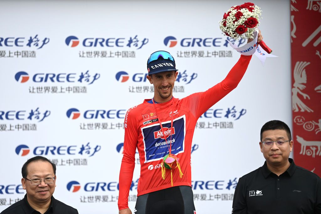 NANNING CHINA OCTOBER 14 Dries De Bondt of Belgium and Team AlpecinDeceuninck celebrates at podium as Red Leader Jersey winner during the 4th GreeTour of Guangxi 2023 Stage 3 a 1343km stage from Nanning to Nanning UCIWT on October 14 2023 in Nanning China Photo by Tim de WaeleGetty Images