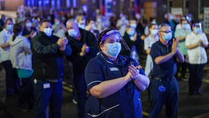 NHS workers clap during Covid-19 pandemic