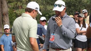 Matt Fitzpatrick chats with a Rules official