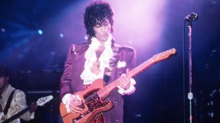 American singer Prince (1958-2016) performs onstage during the 1984 Purple Rain Tour on November 4, 1984, at the Joe Louis Arena in Detroit, Michigan.