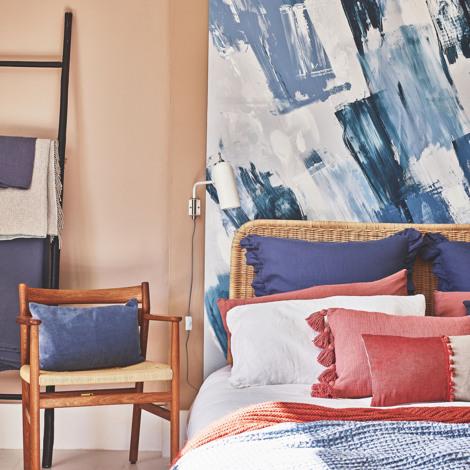 bedroom with painted canvas headboard and pillows