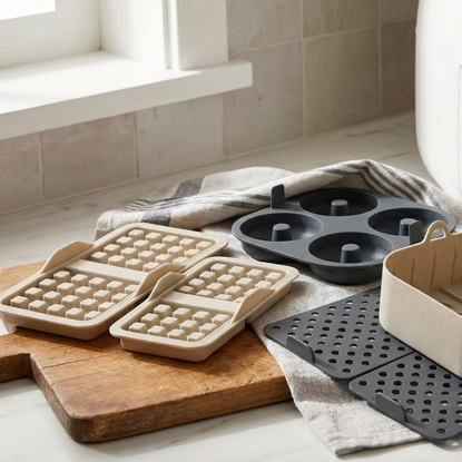 Gemini-generated image of Aldi's air fryer accessories on a marble kitchen worktop, next to an air fryer