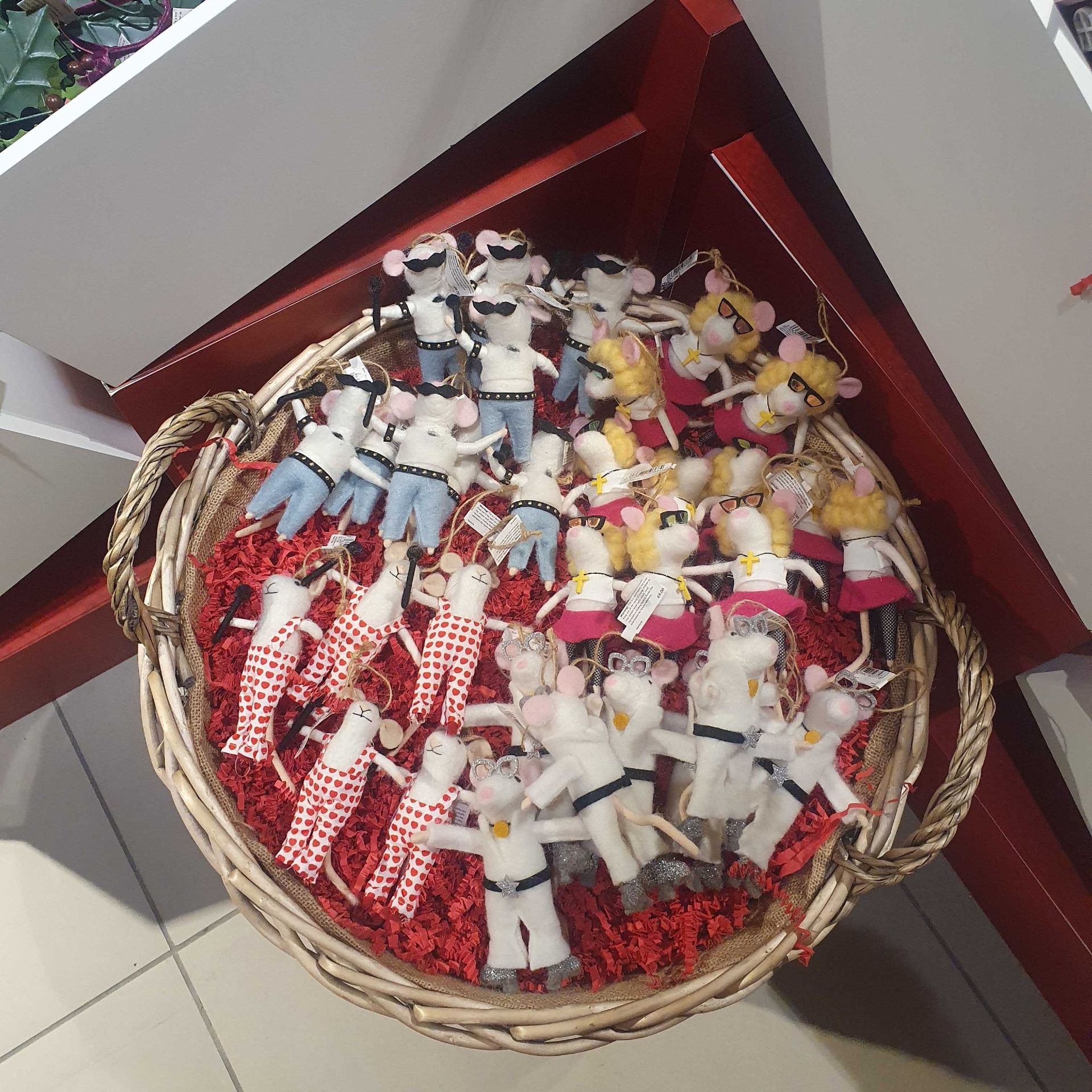 A basket display of felt mice Christmas decorations from John Lewis at their Christmas shop on Oxford Street