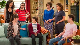 The cast of One Day At A Time has a large living room discussion.