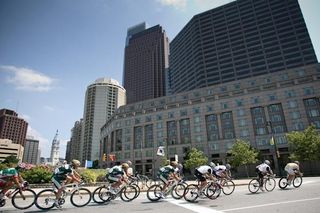 Riders pass under the Philly skyline.
