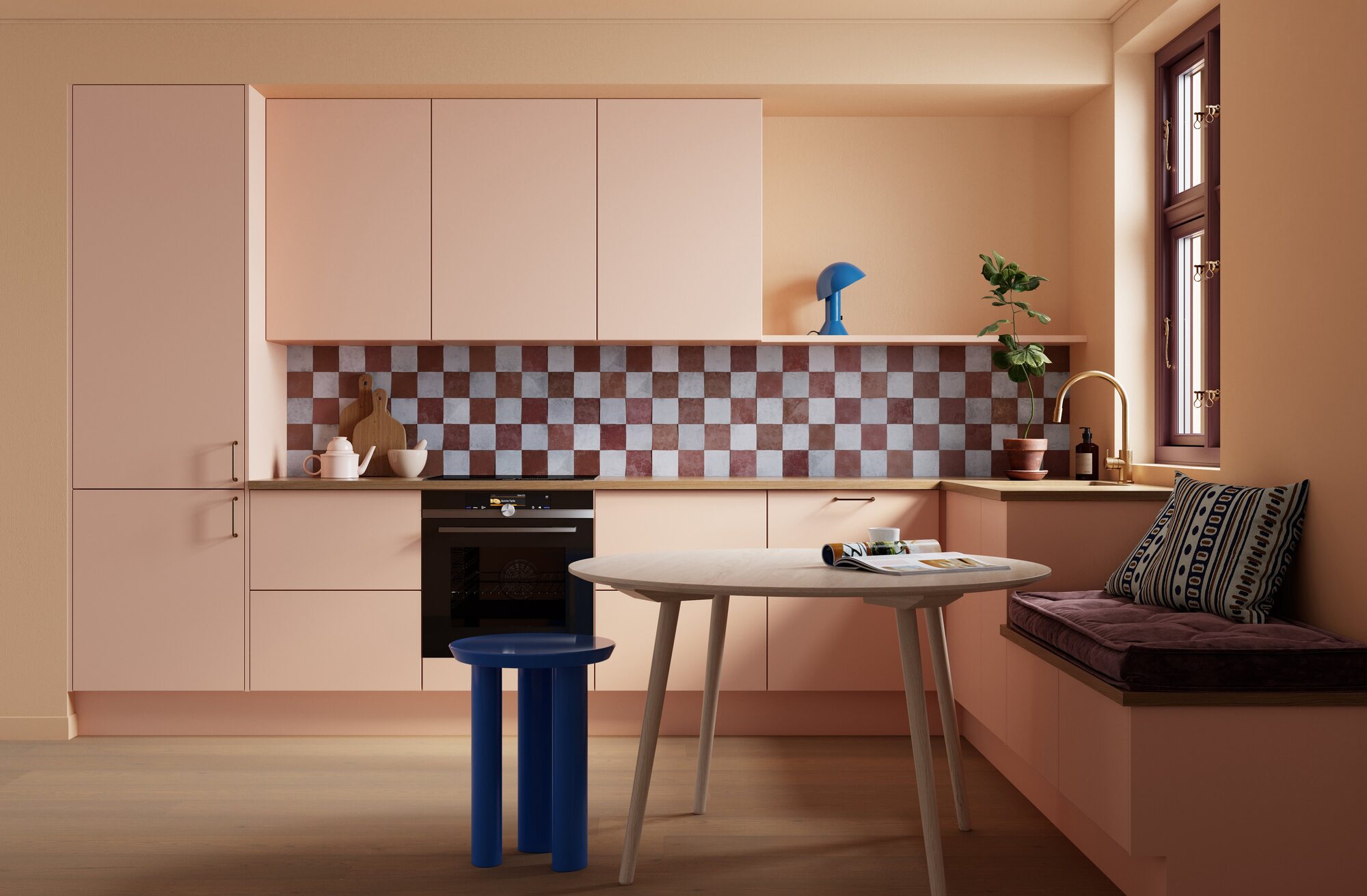 peach colored kitchen cabinetry with checkerboard tiled backsplash, timber countertops, built-in bench seat, round timber tables with blue stool