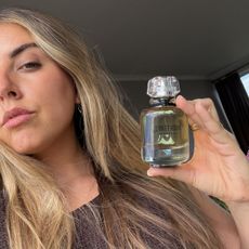 Shannon Lawlor holding Givenchy L'Interdit