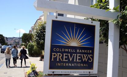 A realtor sign is posted in front of a home for sale on May 28 in San Francisco.