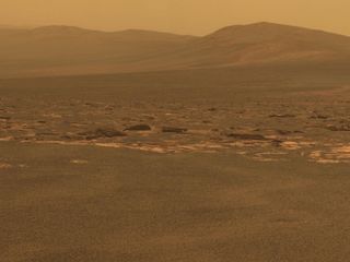 A portion of the west rim of Endeavour crater sweeps southward in this color view from NASA's Mars Exploration Rover Opportunity. This crater — with a diameter of about 14 miles (22 kilometers) — is more than 25 times wider than any that Opportunity has previously approached during the rover's 8 years on Mars.