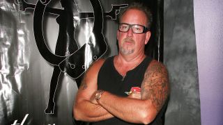 An image of Darrell Sheets in his signature tank top and glasses at an event in 2011.