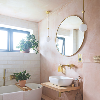 pink bathroom with gold hardware