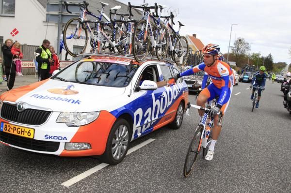 A Rabobank rider drops back to the team car