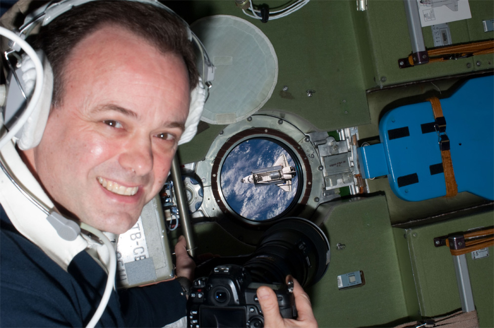 Astronaut Ron Garan on the International Space Station photographs the space shuttle.