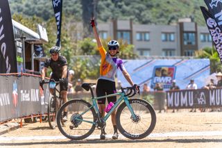 Sofia Gomez Villafañe holds up three fingers, noting she has won BWR Tripel Crown of Gravel in 2024 with victory at BWR California on April 27