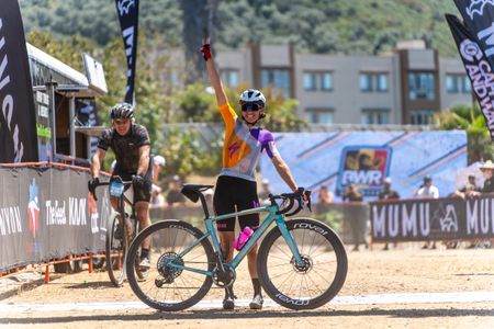 Sofia Gomez Villafañe holds up three fingers, noting she has won BWR Tripel Crown of Gravel in 2024 with victory at BWR California on April 27