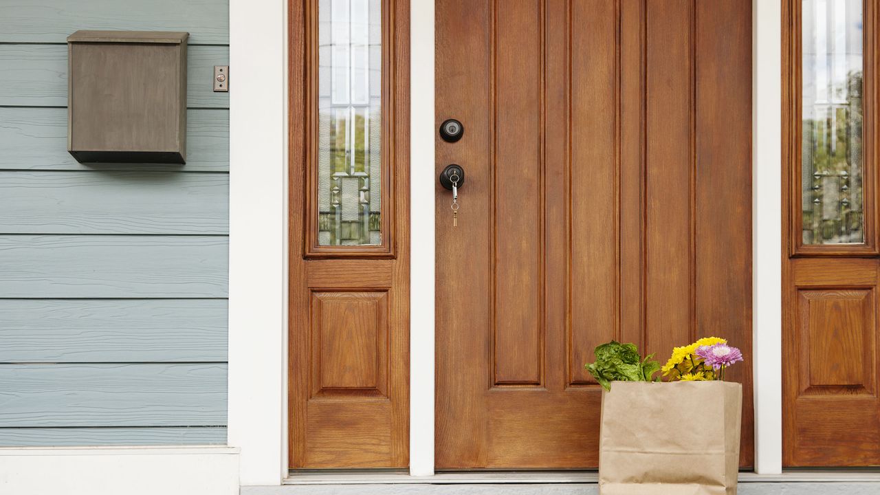 front door with bag of grocerties on the porch for the IRS knocking story