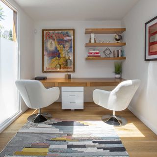 home office with white wall and wooden floor