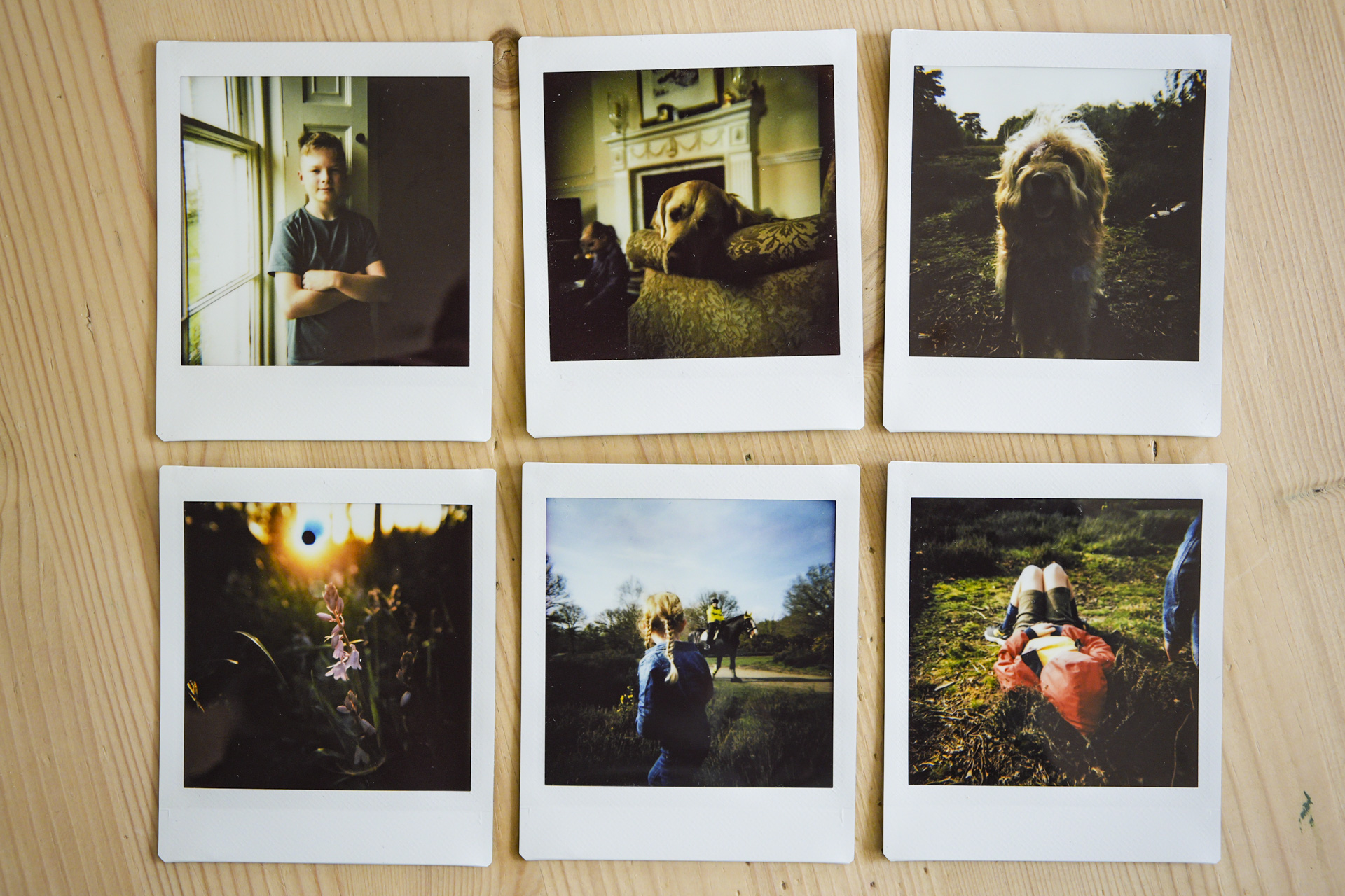Flat lay of six instant prints taken with the Nons SL660 instant camera